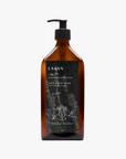 La Eva x Petersham Nurseries Blu face and body wash in an amber glass pump bottle