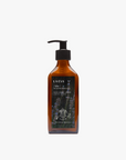 La Eva x Petersham Nurseries Blu face and body lotion in an amber glass pump bottle