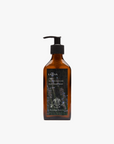 La Eva x Petersham Nurseries Blu face and body wash in an amber glass pump bottle