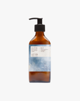 La Eva x Rose-Marie Caldicott Blu hand and body lotion in an amber glass pump bottle