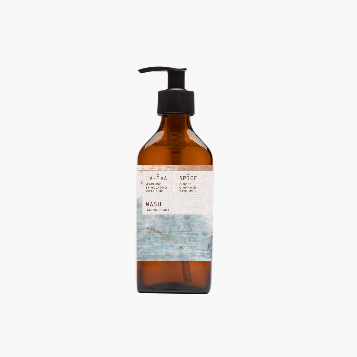 A recycled amber glass pump bottle of La-Eva Spice Hand & Body wash with a label featuring artwork by Emma Cassi,  Spicy wash; ginger, patchouli, cinnamon