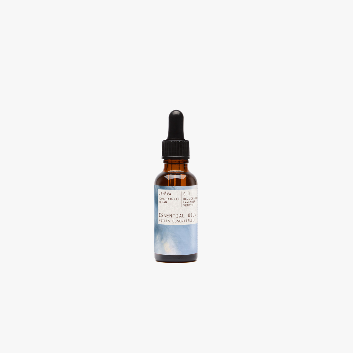 La-Eva blu essential oil in amber glass bottle with pippette. Label features artwork by Rose-Marie Caldicott