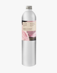 A tall, slender aluminium bottle of Roseum Conditioner sustainable refill. Label featuring Meinke Flessemen artwork.