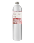 A tall, slender aluminium bottle of Roseum hand and body lotion sustainable refill. Label featuring Meinke Flessemen artwork.
