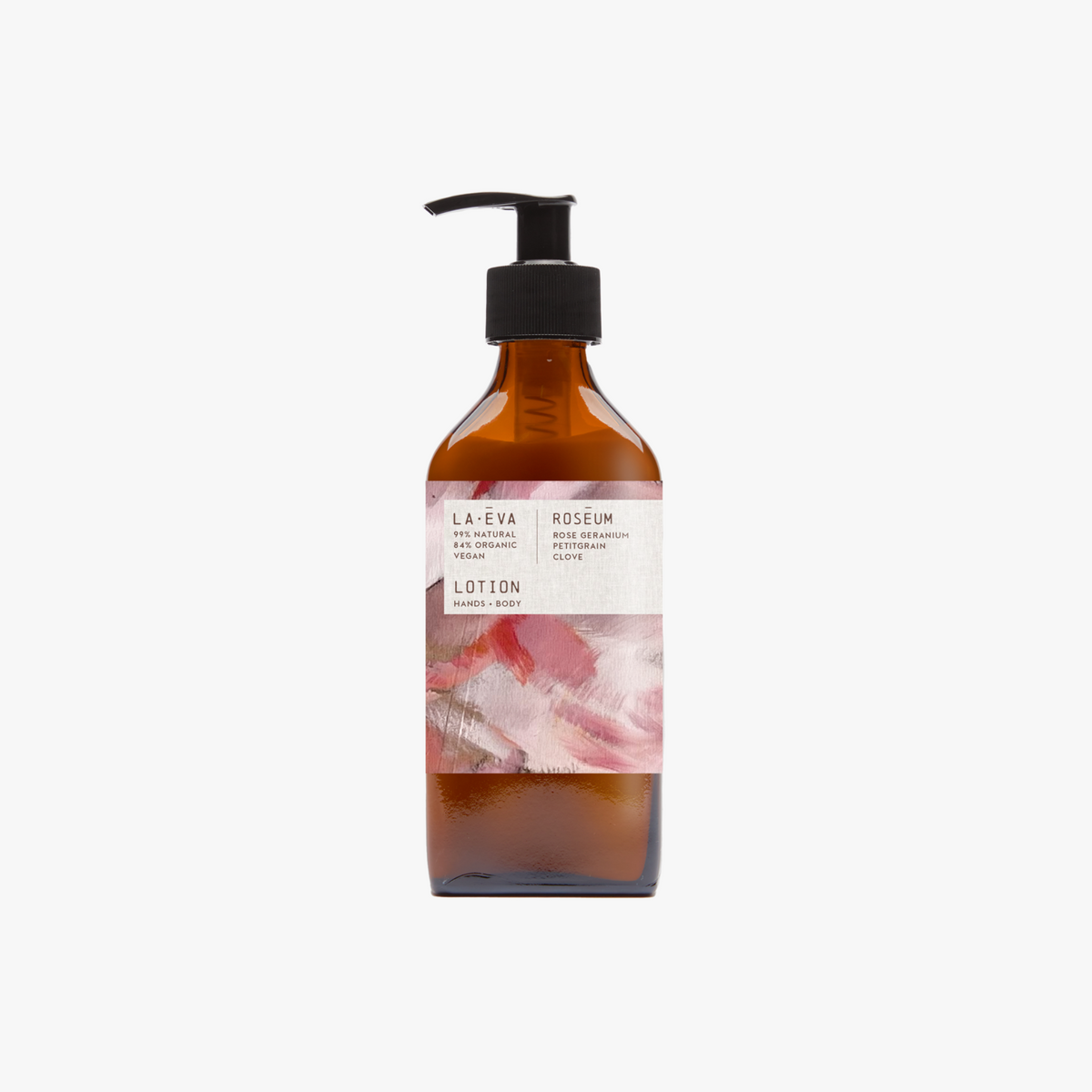 A 200ml recycled amber glass pump bottle of Roseum Hand & Body Lotion with a label featuring 'Flamingos' artwork by Meinke Flessemen and the text 'roséum' part of the rose geranium botanical, Pelargonium roseum.