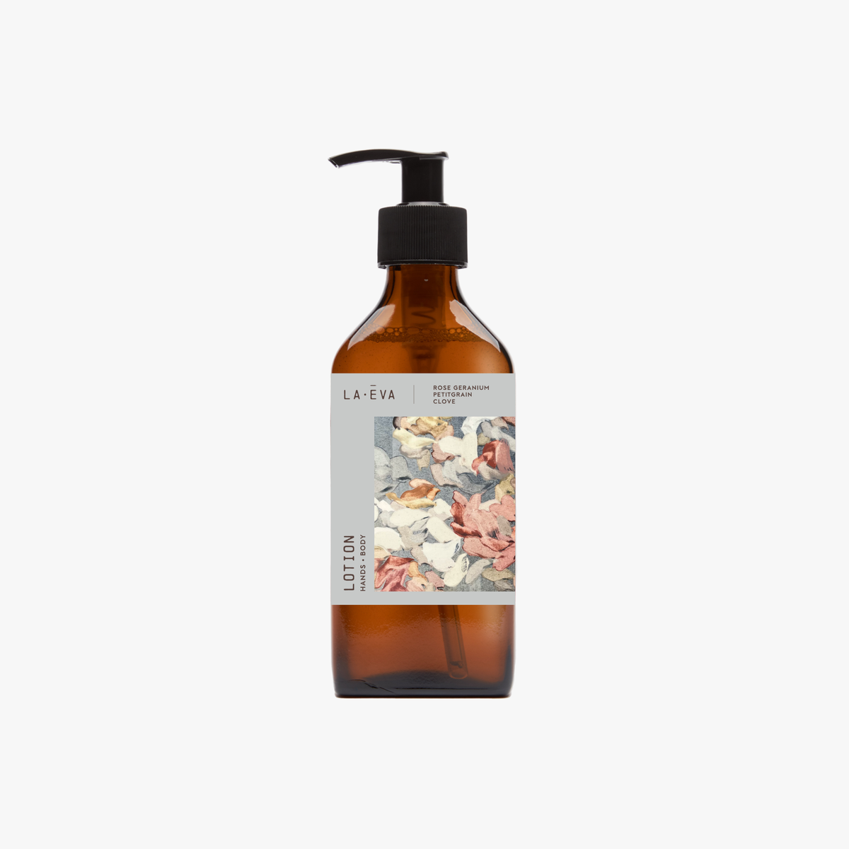 A recycled amber glass pump bottle of La-eva Roseum Hand & Body lotion with a label featuring 'Younger Together' artwork by Valeska Hykel and the text 'roséum ', part of the rose geranium botanical, Pelargonium roseum.