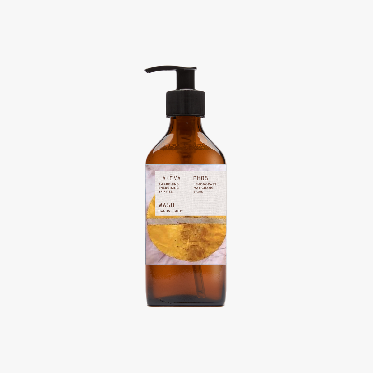 A recycled amber glass pump bottle of Phos Hand & Body Wash with a label featuring artwork by Emma Cassi, Phos; lemongrass, may chang and basil