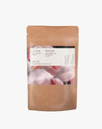 A package of La Eva Roseum Exfoliant & Bath Salts with a label featuring artwork by Meinke Flessemen