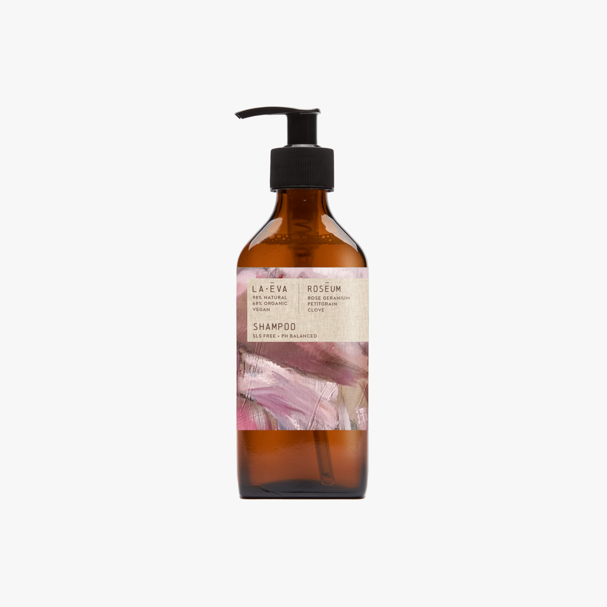 A pump bottle of Roseum Shampoo with a label featuring 'Flamingos' artwork by Meinke Flessemen and the text 'roséum' part of the rose geranium botanical, Pelargonium roseum.