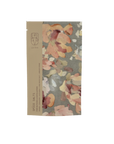 A package of La-Eva Linden Exfoliant & Bath Salts with a label featuring artwork "At Your Pace" by Valeska Hykel