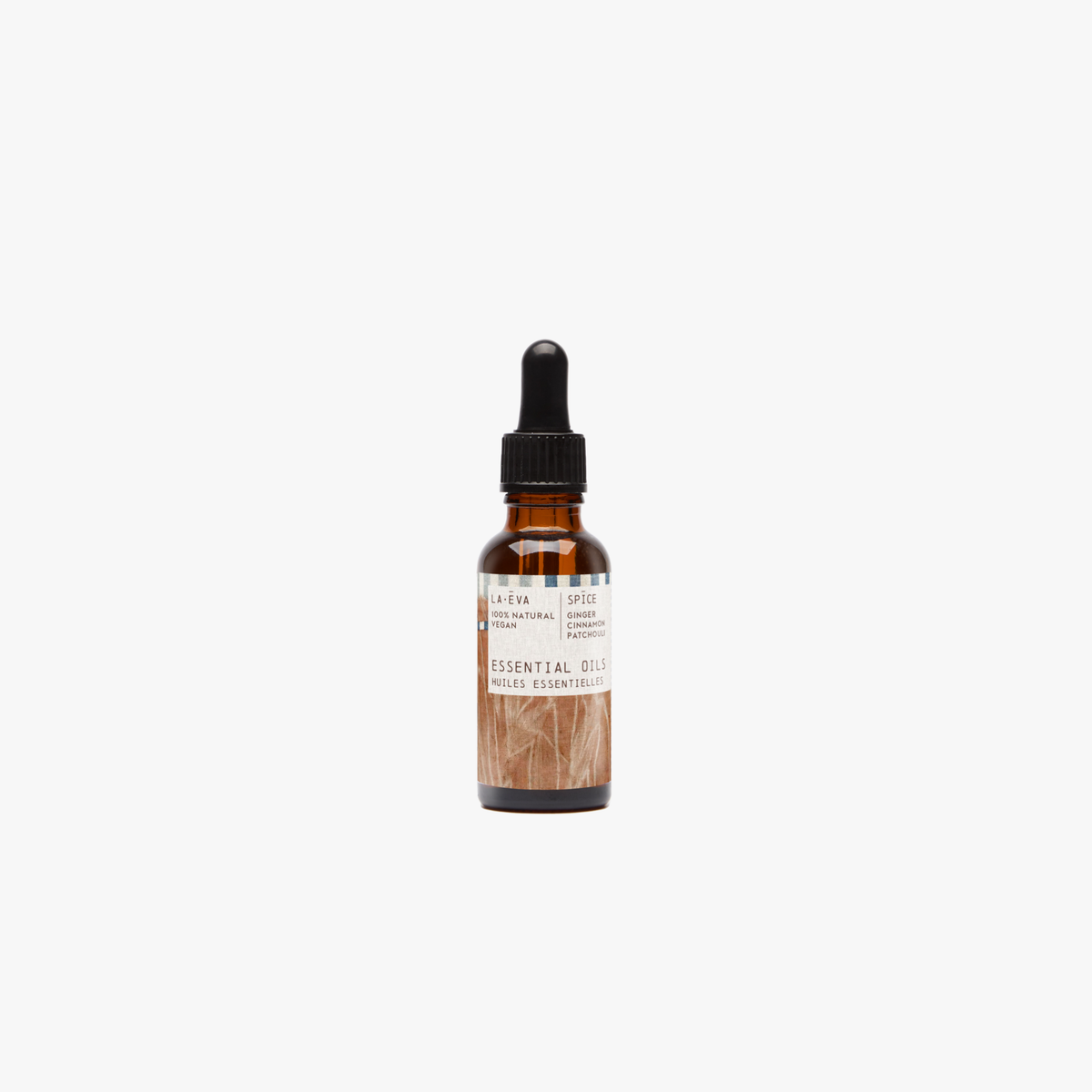 La-Eva spice essential oil in amber glass bottle with pippette. Label features artwork by Emma Cassi
