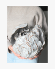 La Eva x Katie-Coston holding original artwork "anthos"