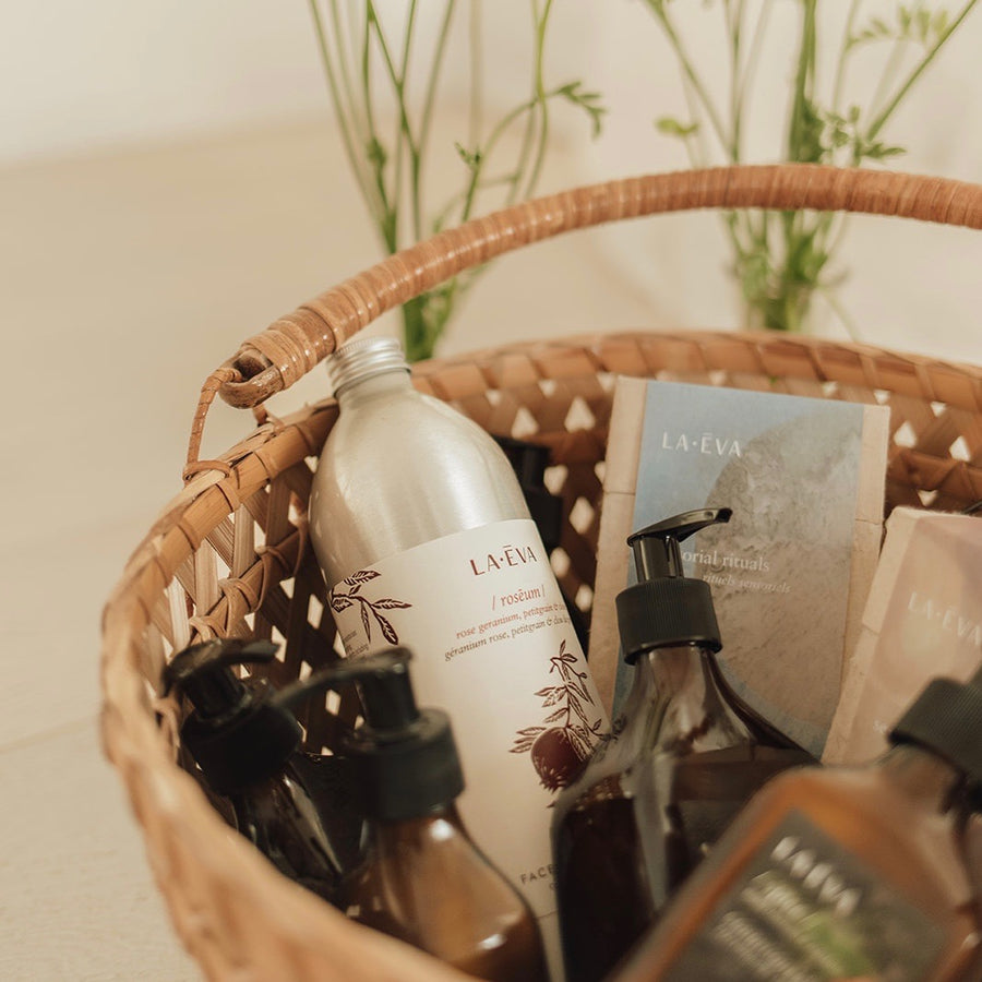 basket of various La-Eva products including 1L refill of La-Eva Roseum face and body wash
